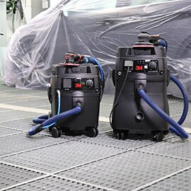 Imagen de dos sistemas de lijado en un taller de carrocer&iacute;a